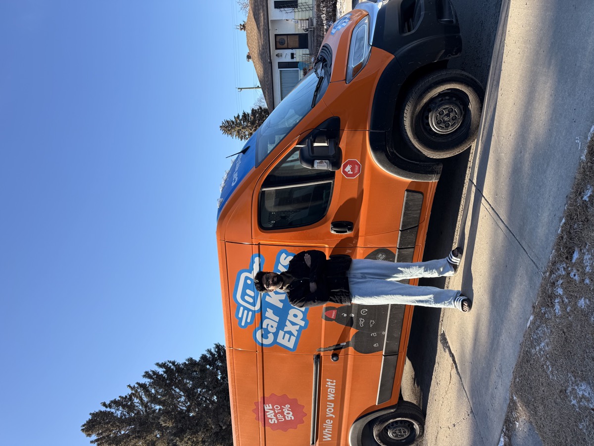 The Visma Promotions Inc. branded Car Keys Express service vehicle parked at a retail location in Edmonton